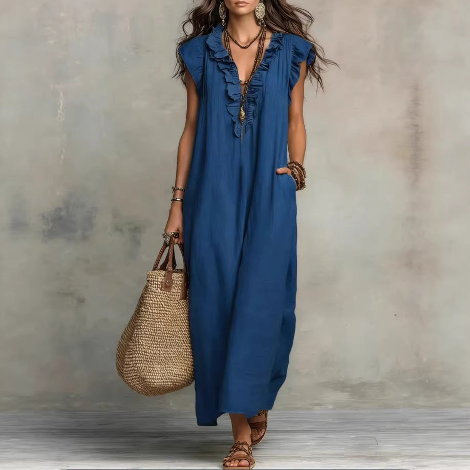 Blue sleeveless maxi dress with ruffled shoulder detail and keyhole button front