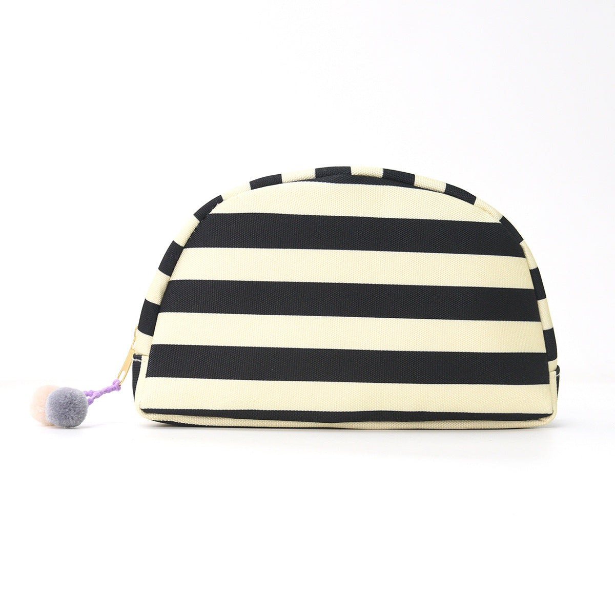 Striped shell makeup bag in black and cream with pom-pom zipper pull.