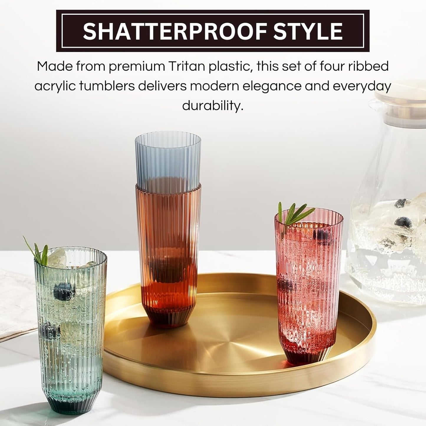 Three tall ribbed tumbler glasses on a tray, translucent muted amber, red, and blue-green
