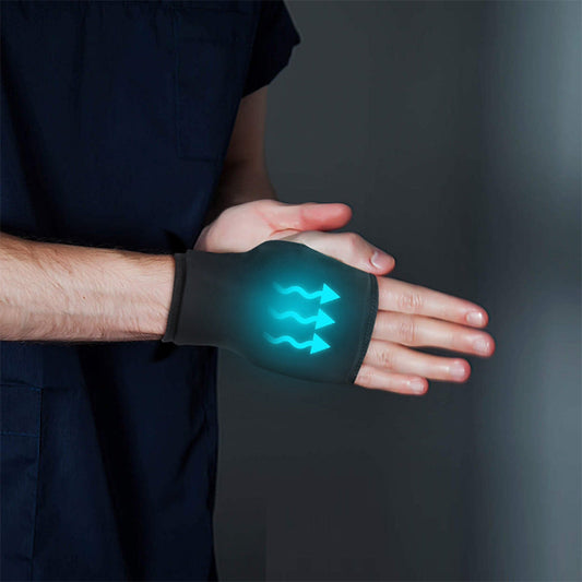 Black microwavable wrist ice pack wrap showing glowing heat/cold gel area on the hand