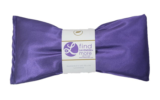 Lavender hot/cold eye pillow with glossy purple fabric bow ends and center label