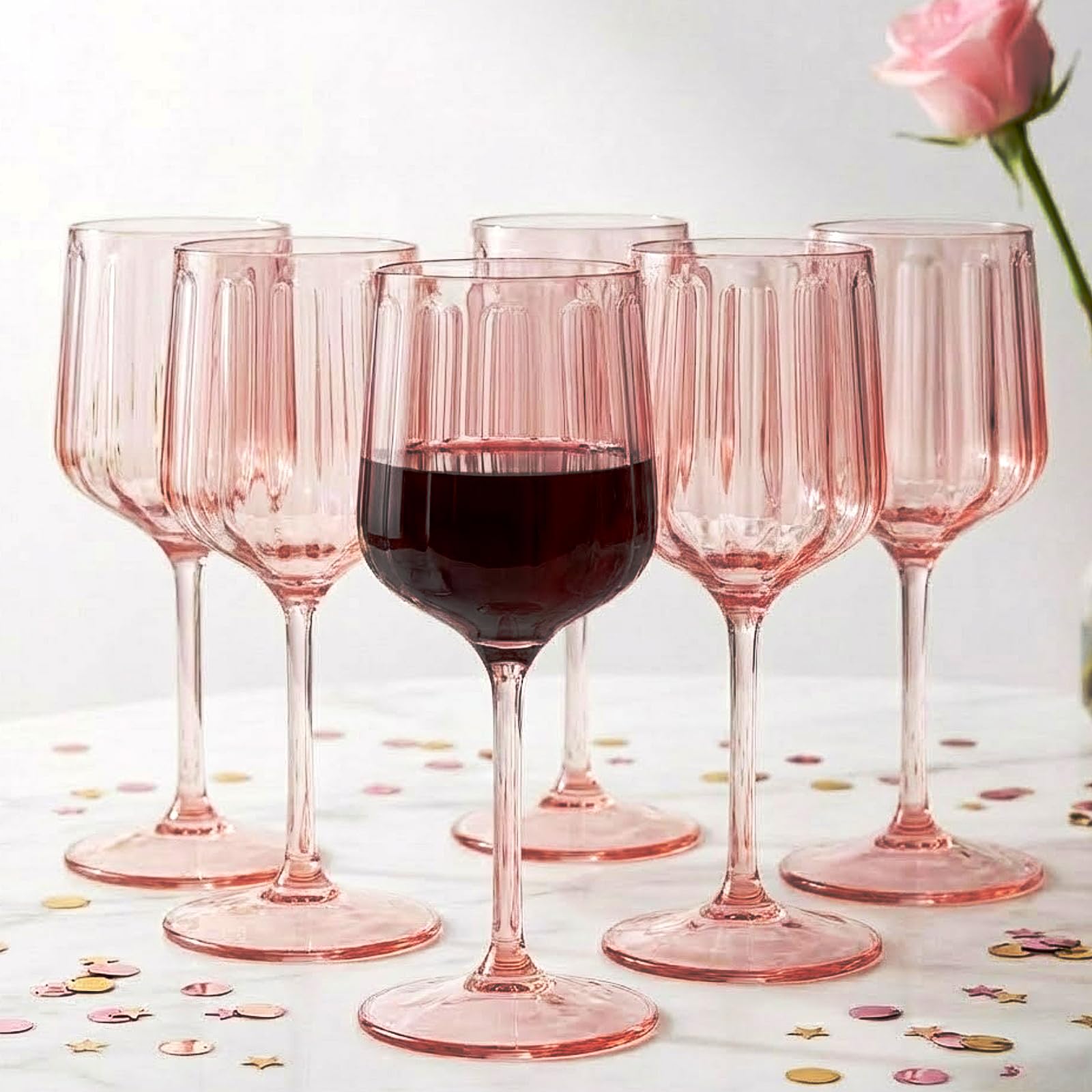 Set of 6 pink acrylic stemmed goblets with ribbed cups and flared round bases