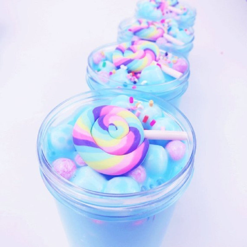 Lollipop slime in clear cup with rainbow swirl lollipop and blue slime