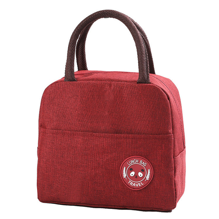Red insulated lunch bag with double handles and round bear logo patch on the front panel.