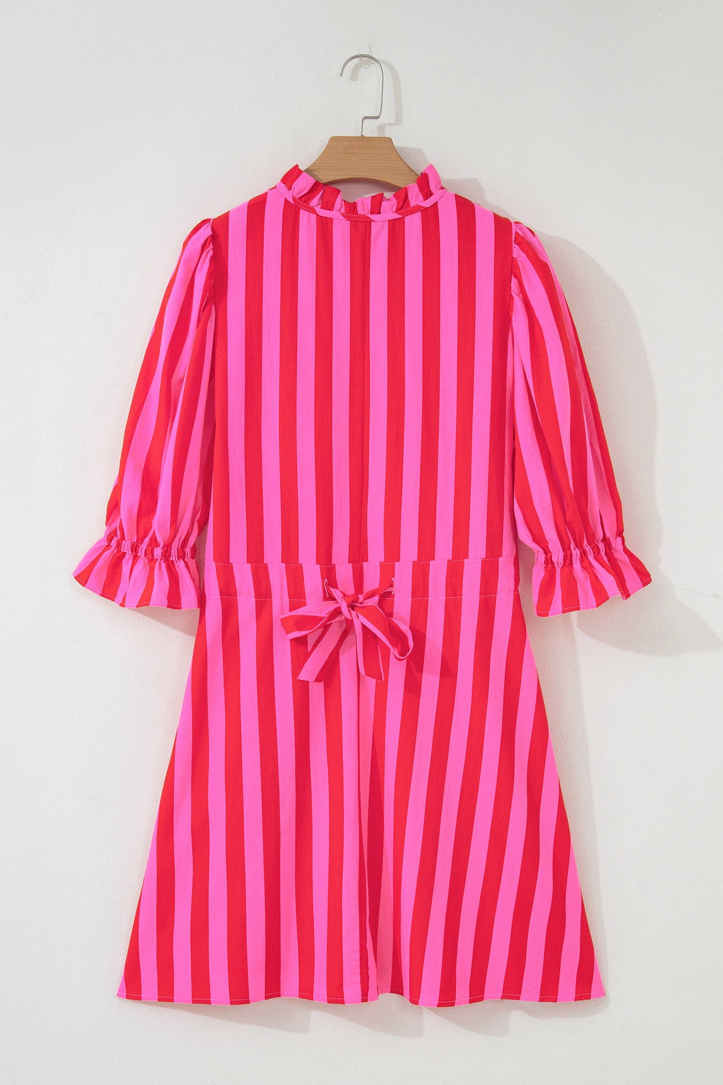Pink and red striped mini dress with bow-tied back and puff sleeves