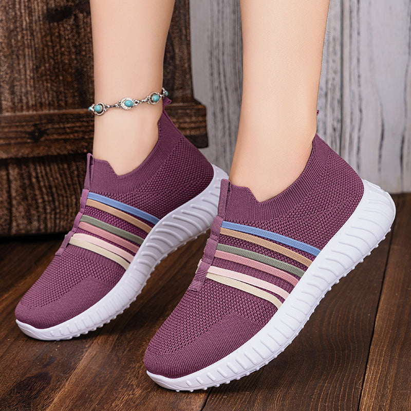 Purple breathable knit slip-on shoes with multicolor striped band and white cushioned sole
