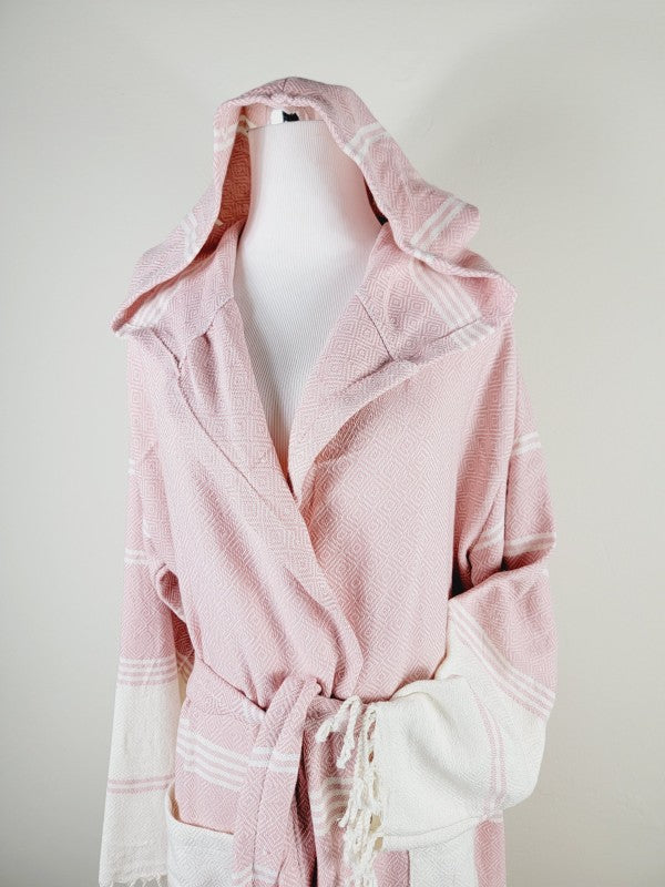 Pink robe close-up with hood, shawl collar, tie belt, and striped cuffs
