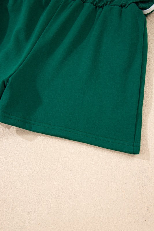 Green mini skirt with gathered elastic waist and white-striped trim