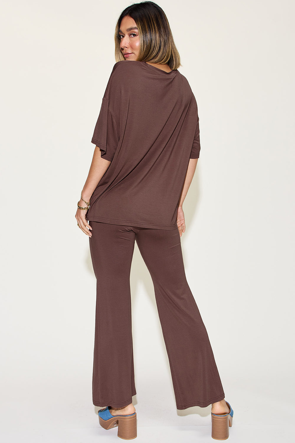 Chocolate brown drop-shoulder t-shirt and flare pants set, back view