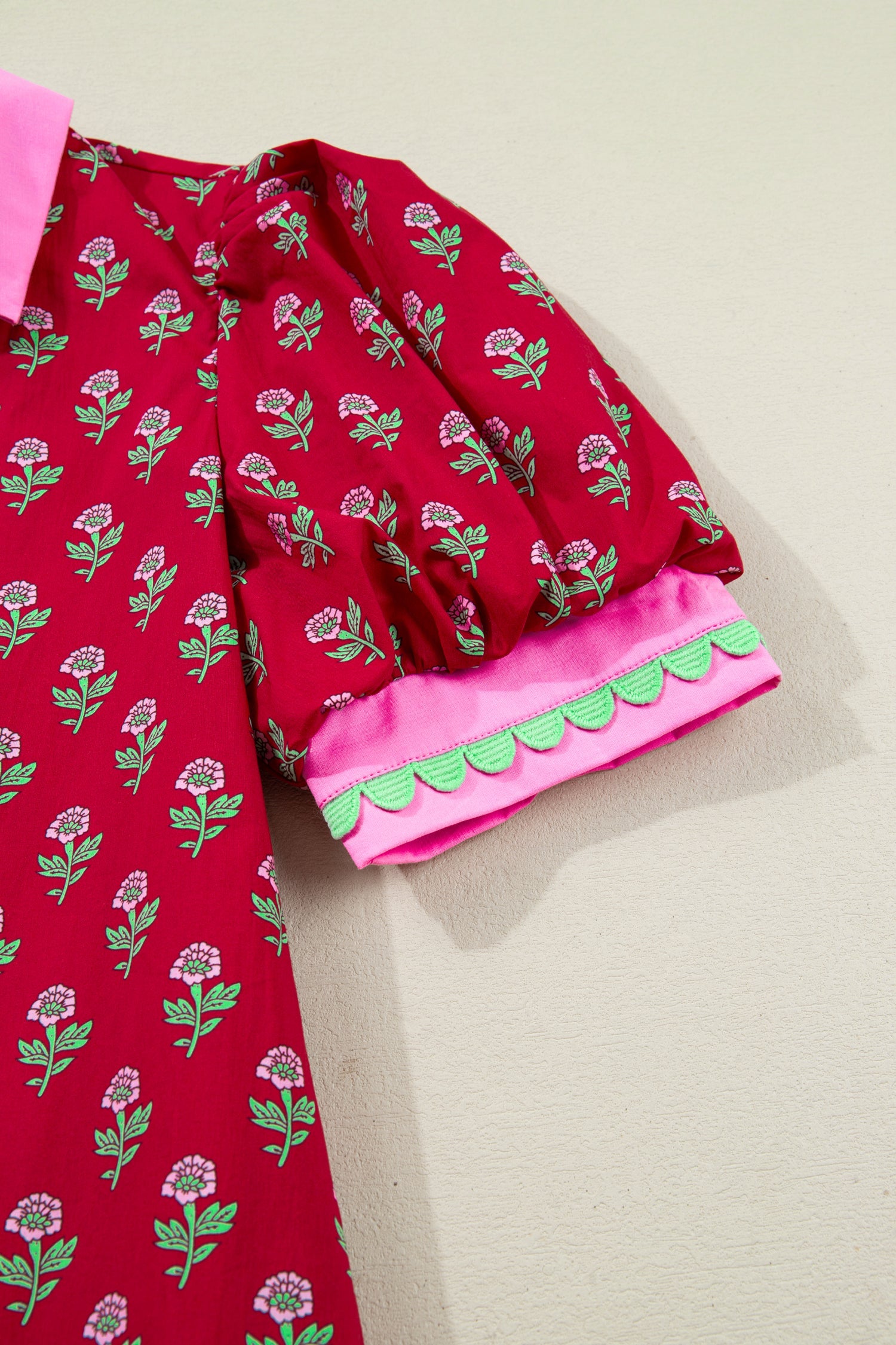 Red mini dress with bubble sleeves and small green floral print