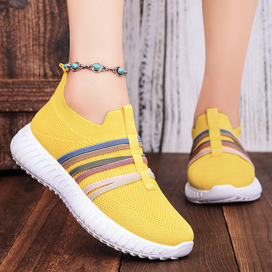 Yellow breathable knit slip-on shoes with striped band and white cushioned sole