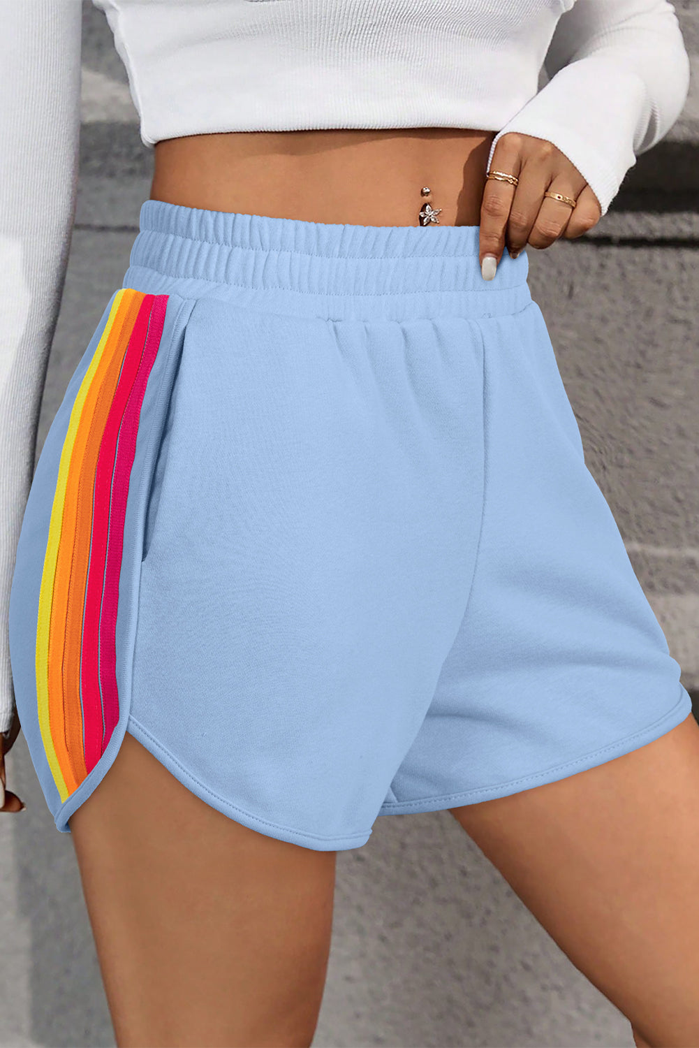 Light blue high-waist active shorts with rainbow vertical side stripe panel