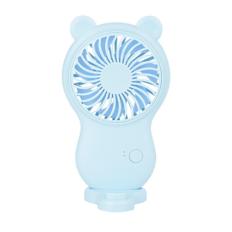 Light blue handheld pocket mini fan with round grille, bear ears, and power control button
