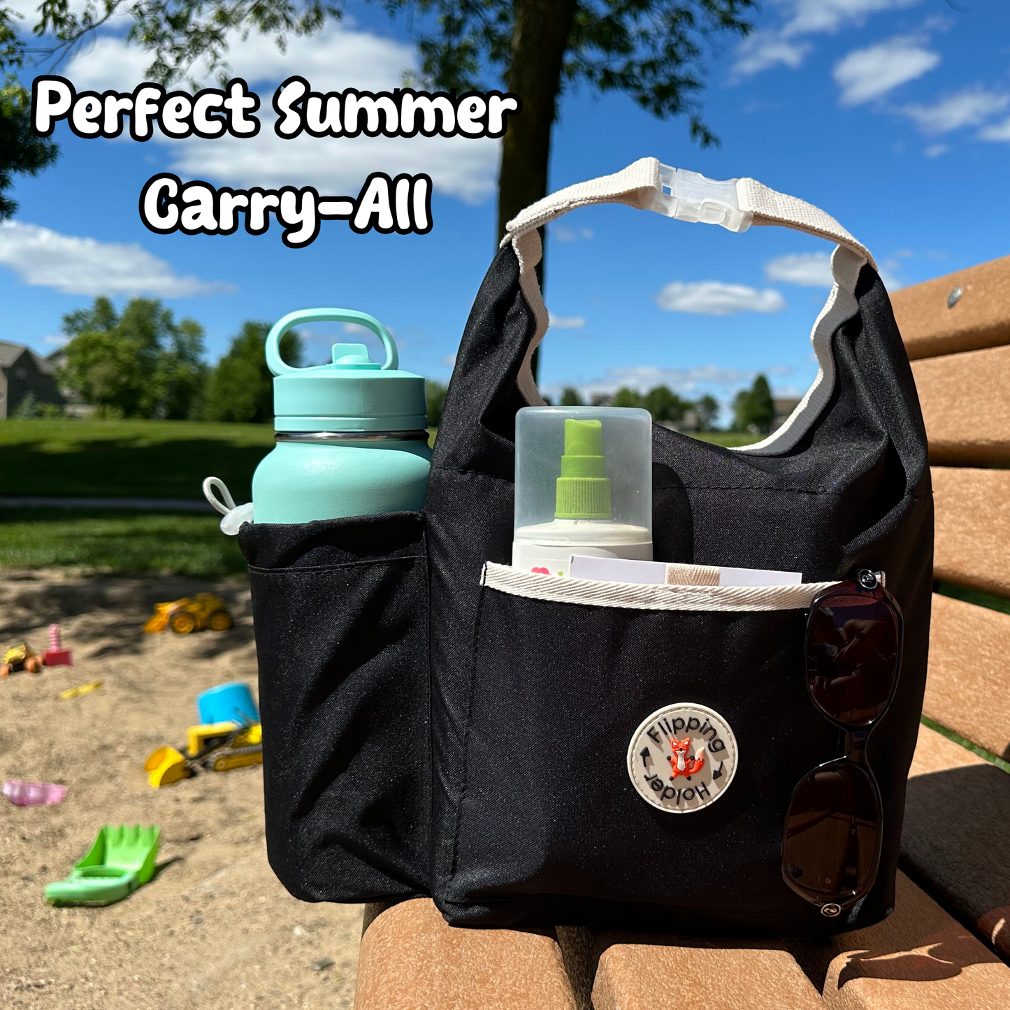 Black thermal tote bag with front bottle pocket holding a teal bottle