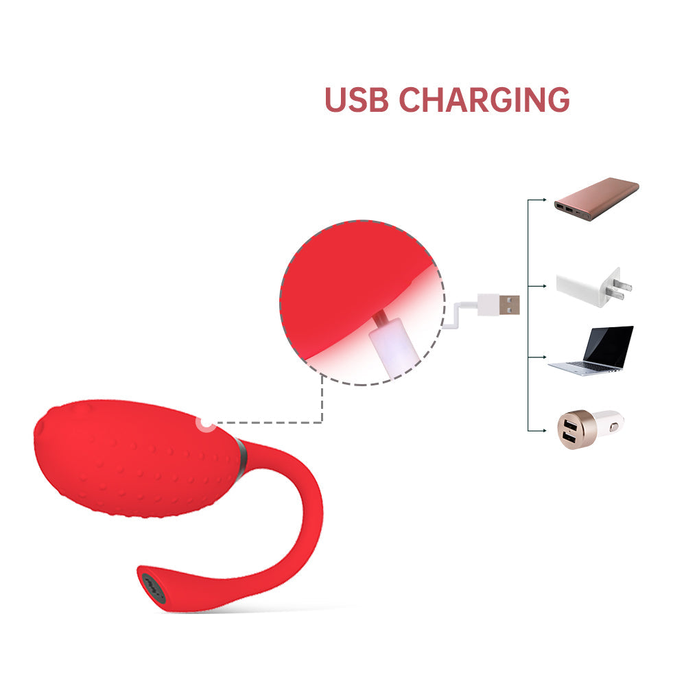 Red silicone massager connected to a USB charging plug and cable.