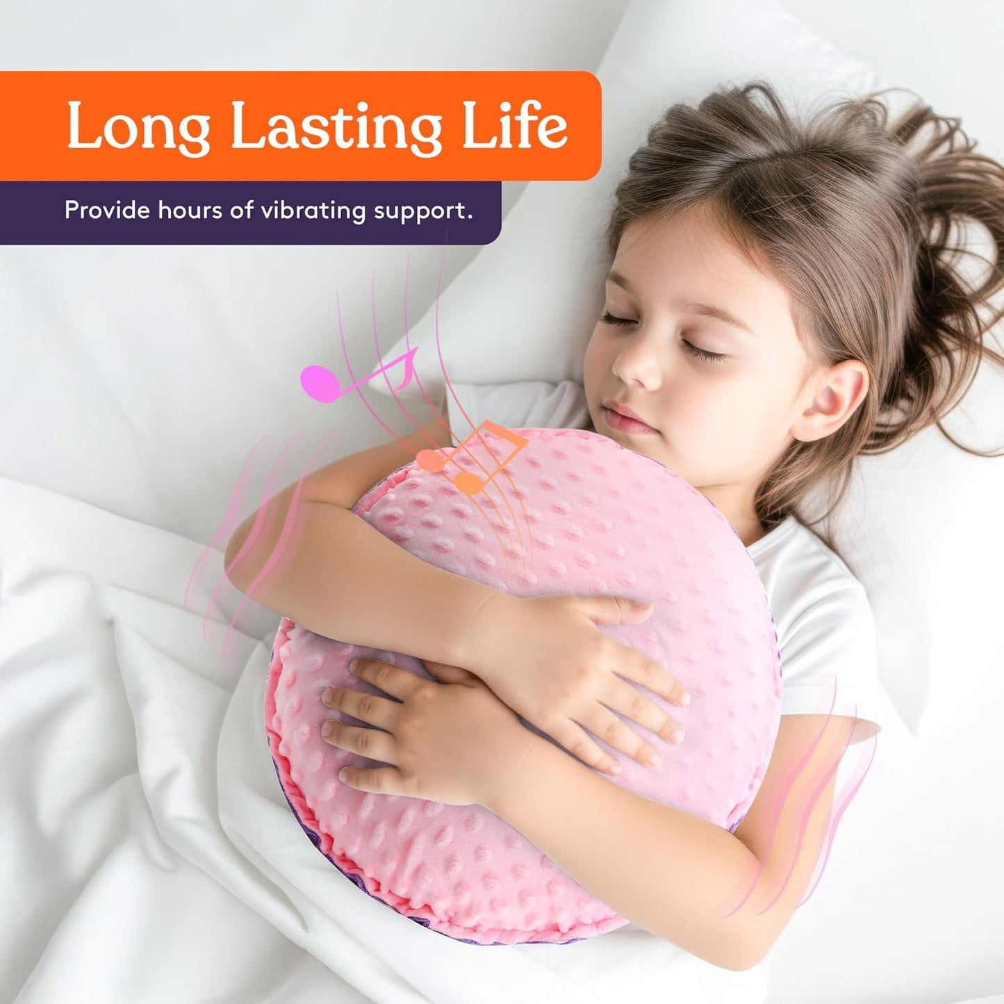 Pink textured plush sensory pillow with raised dots hugged by a child while lying down.