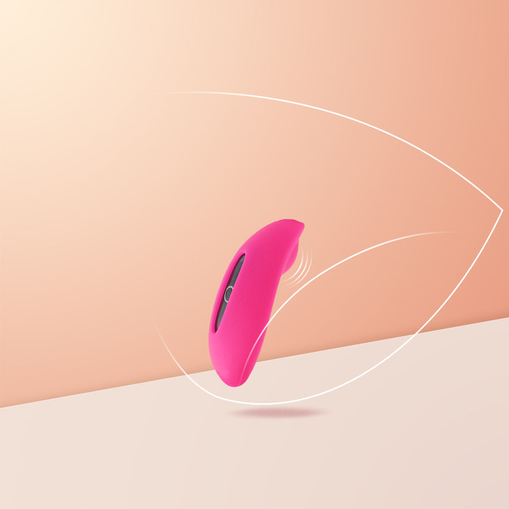Pink silicone personal massager with curved body and dark center opening