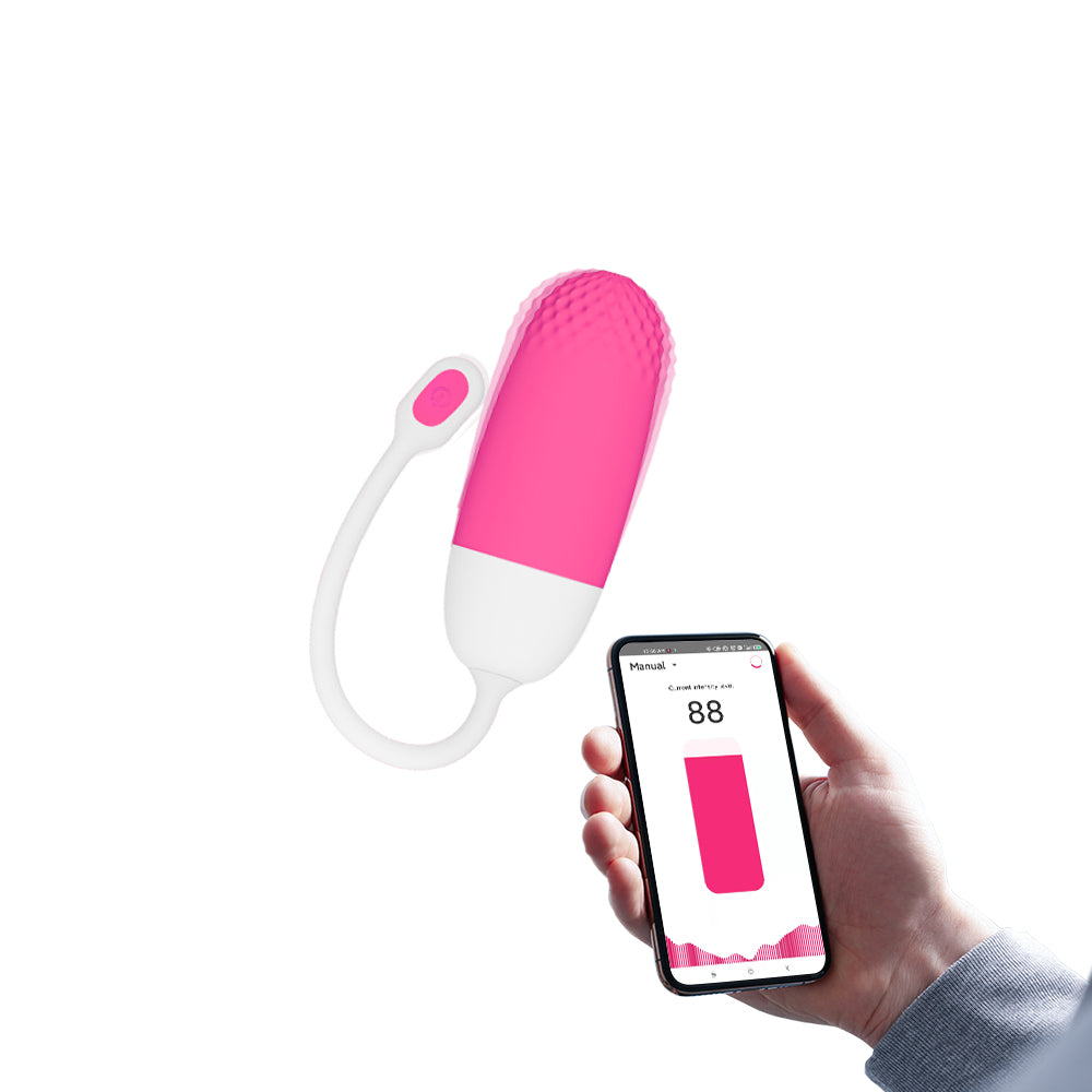 Pink-and-white loop-handled silicone massager shown with a smartphone controller