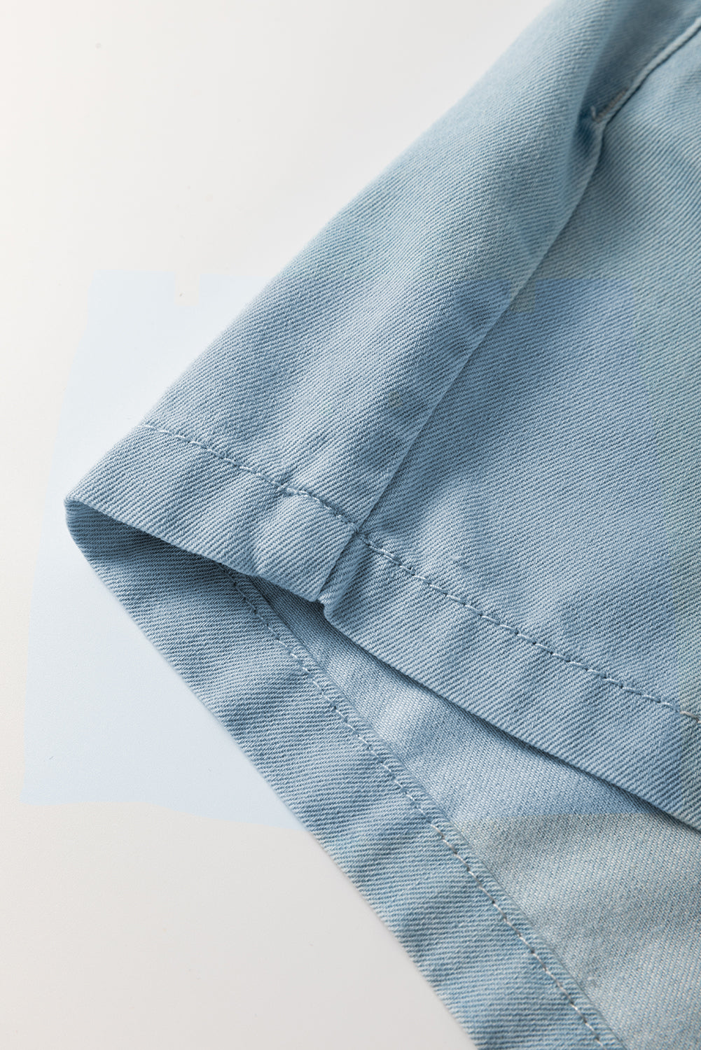 Washed chambray cuff and seam stitching detail, blue