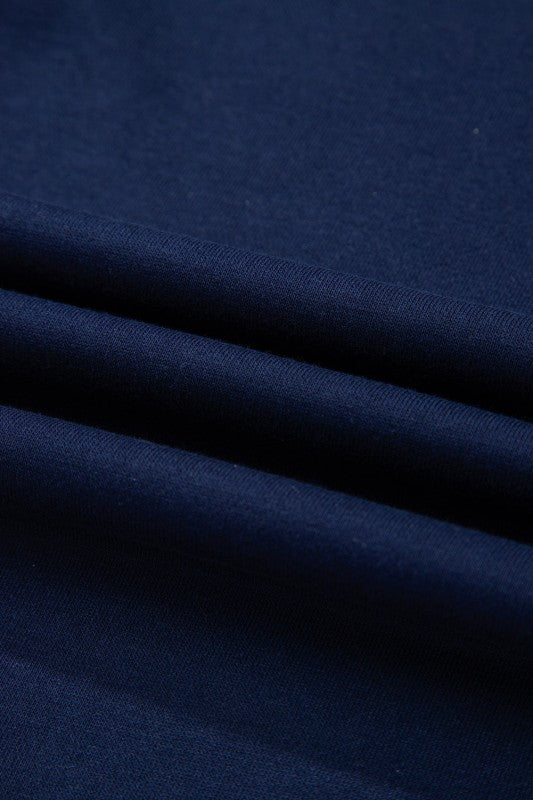 Navy knit fabric and ribbed trim close-up