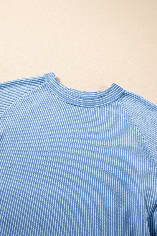 Light blue corded top neckline and ribbed collar detail