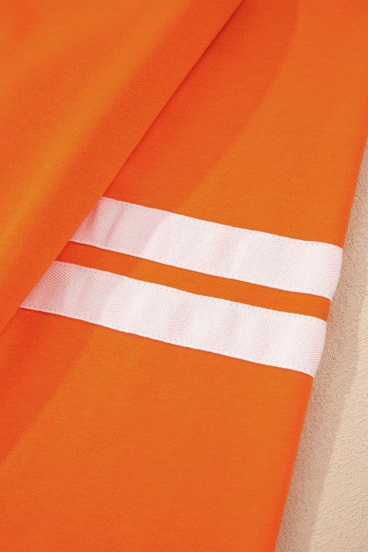 Orange pullover sleeve with two white varsity stripe bands
