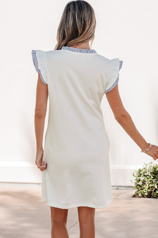 White sleeveless dress, back view, with blue striped ruffle-trim sleeves