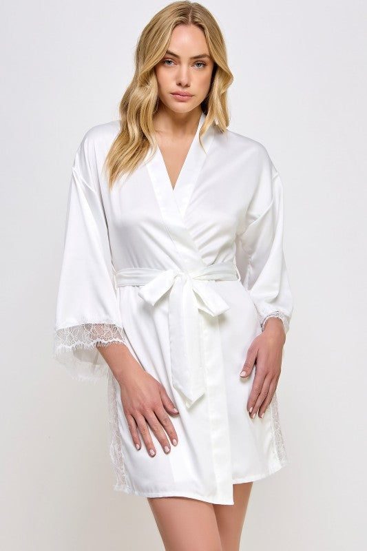 White satin robe with V-neck, tied waist belt, and lace-trimmed sleeve cuffs