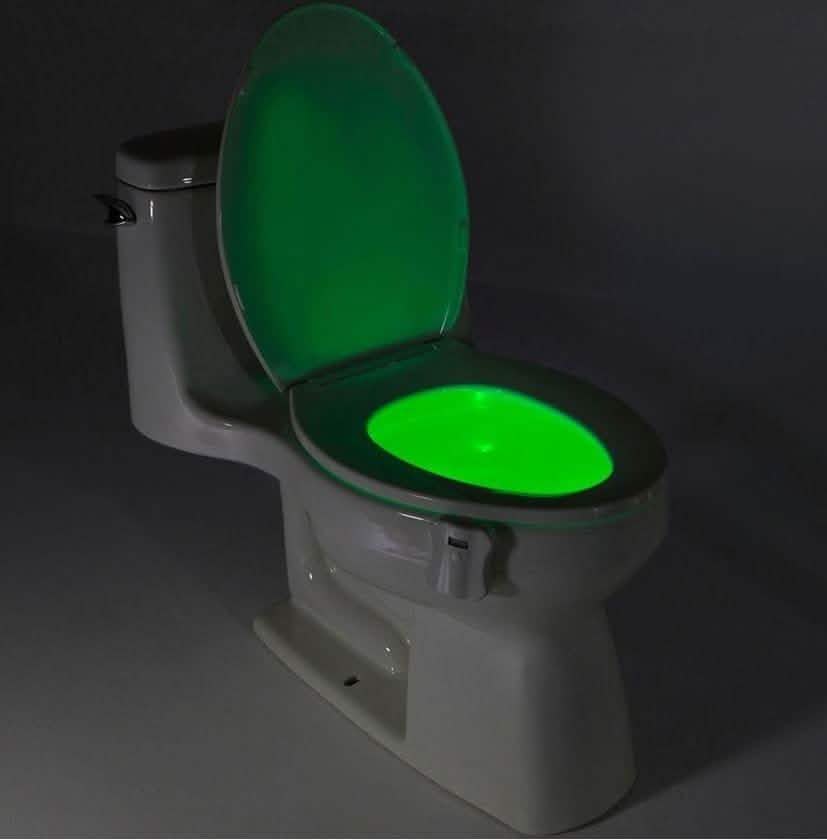 Toilet LED light attachment with green glowing oval on the seat