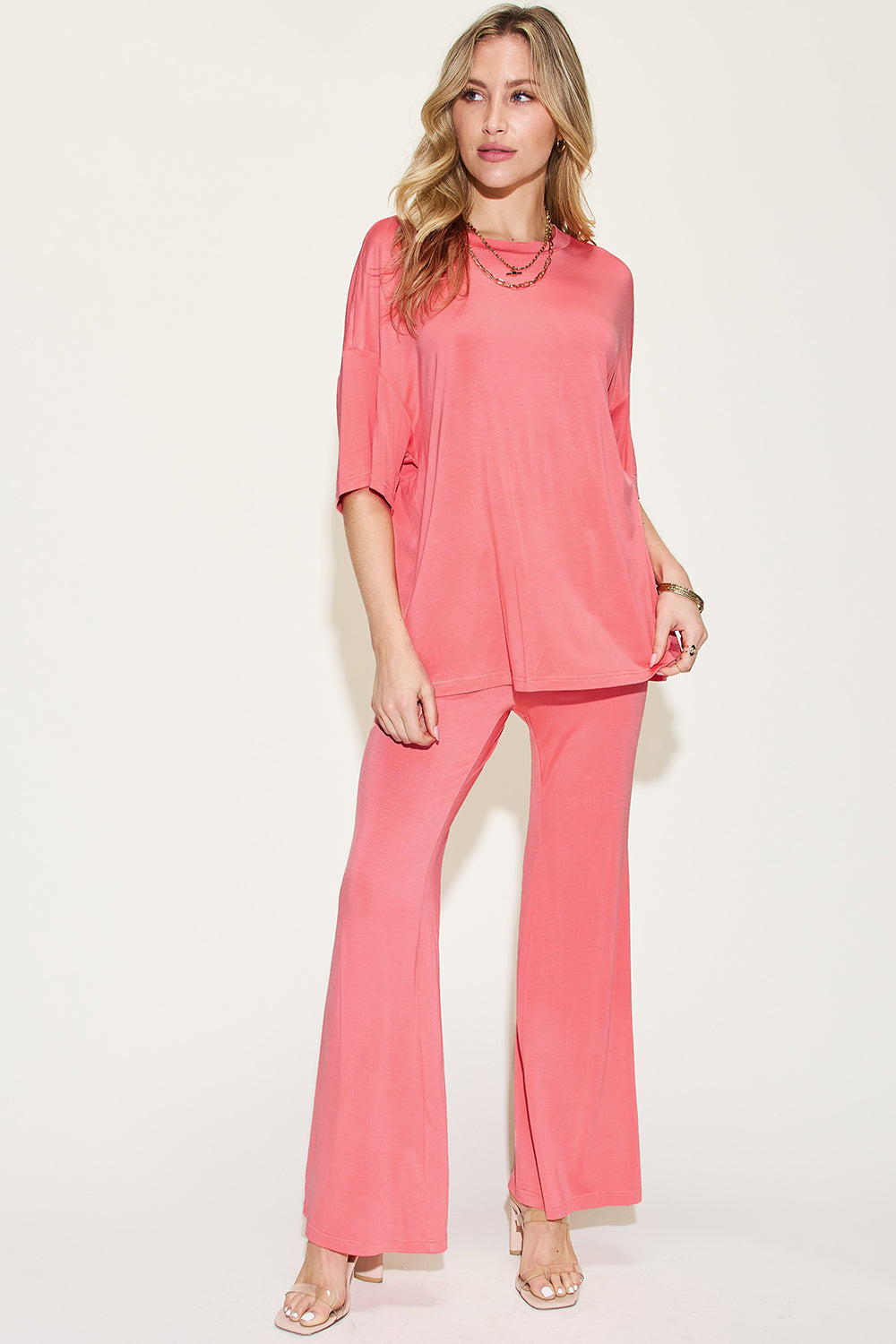 Coral drop-shoulder t-shirt and flare pants set with relaxed drape and flared hems