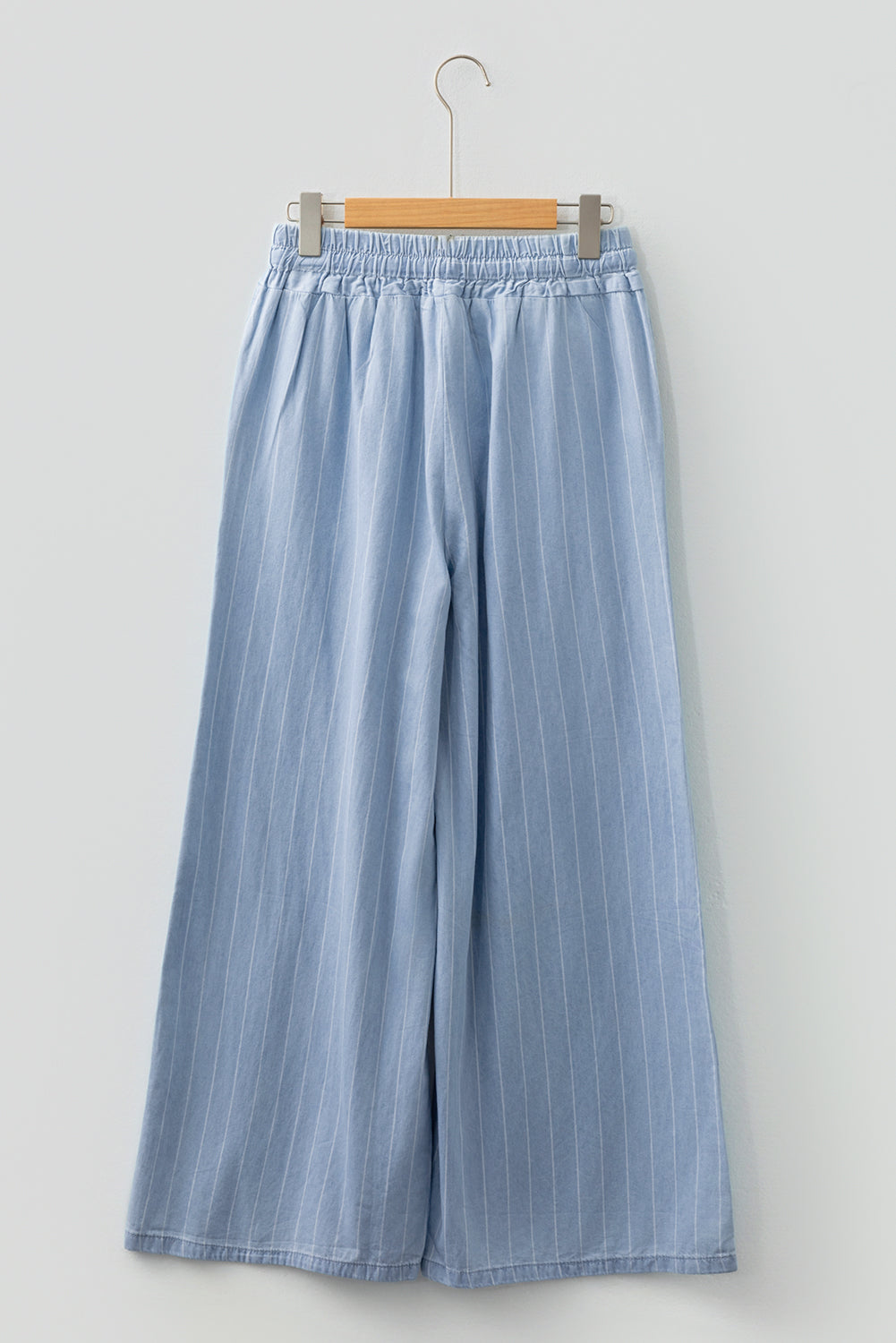 Sky blue stripe tied-waist elastic trousers with wide legs, front view