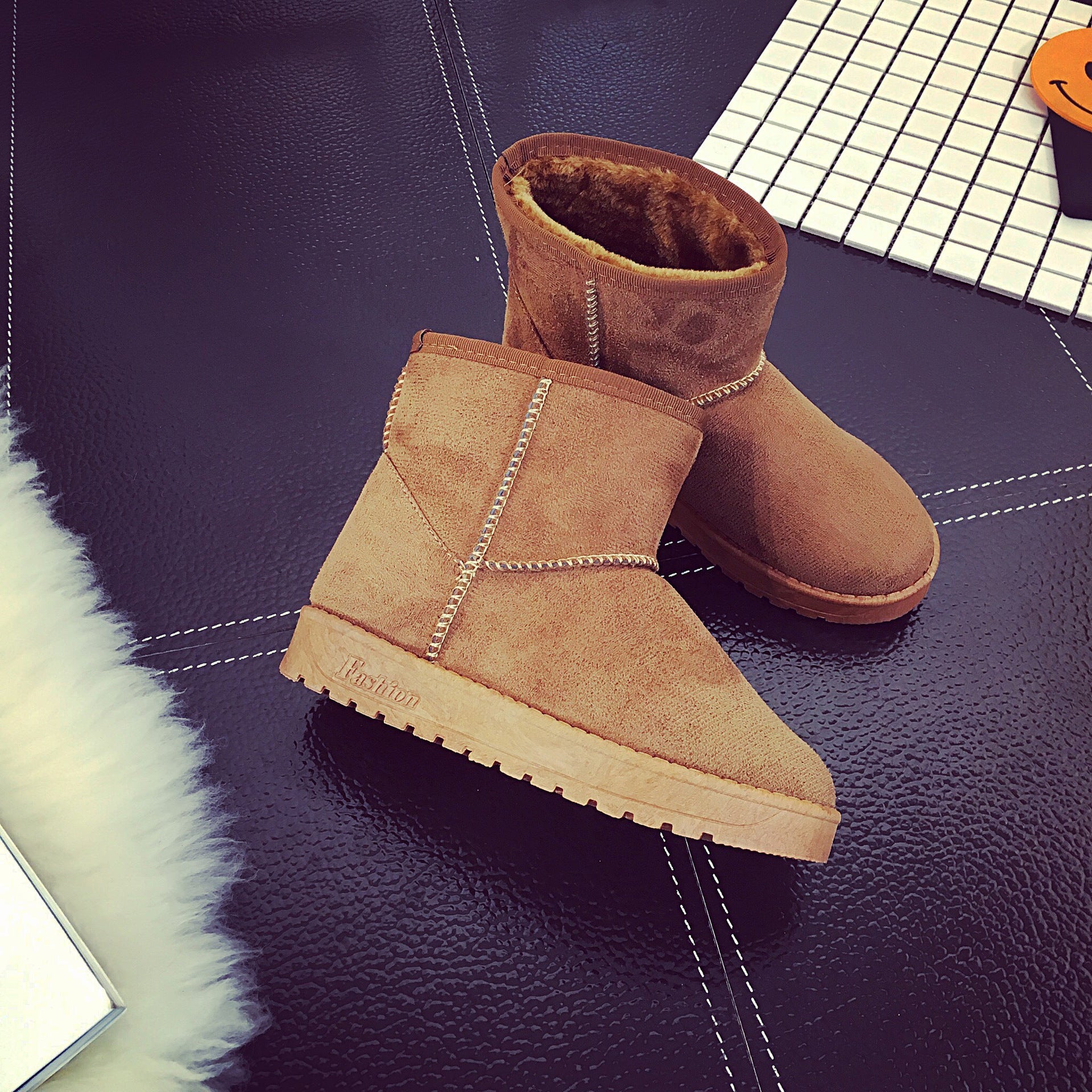 Brown suede winter boots with faux-fur lining, ankle height, and thick lug sole