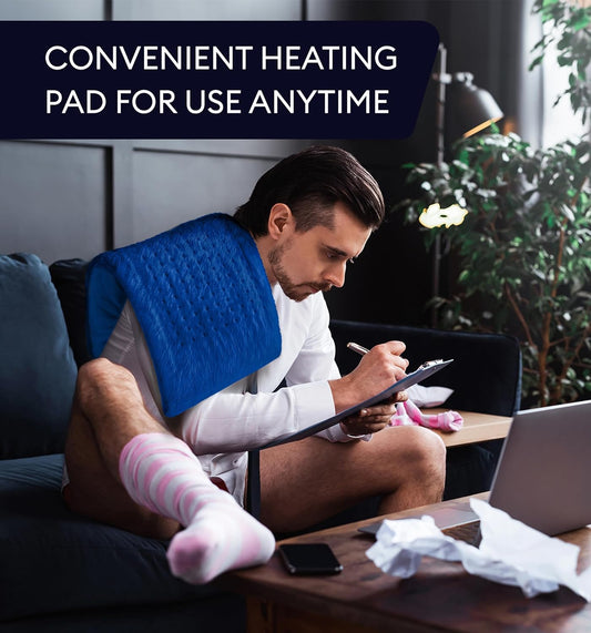 Space blue heating pad on couch with handheld controller