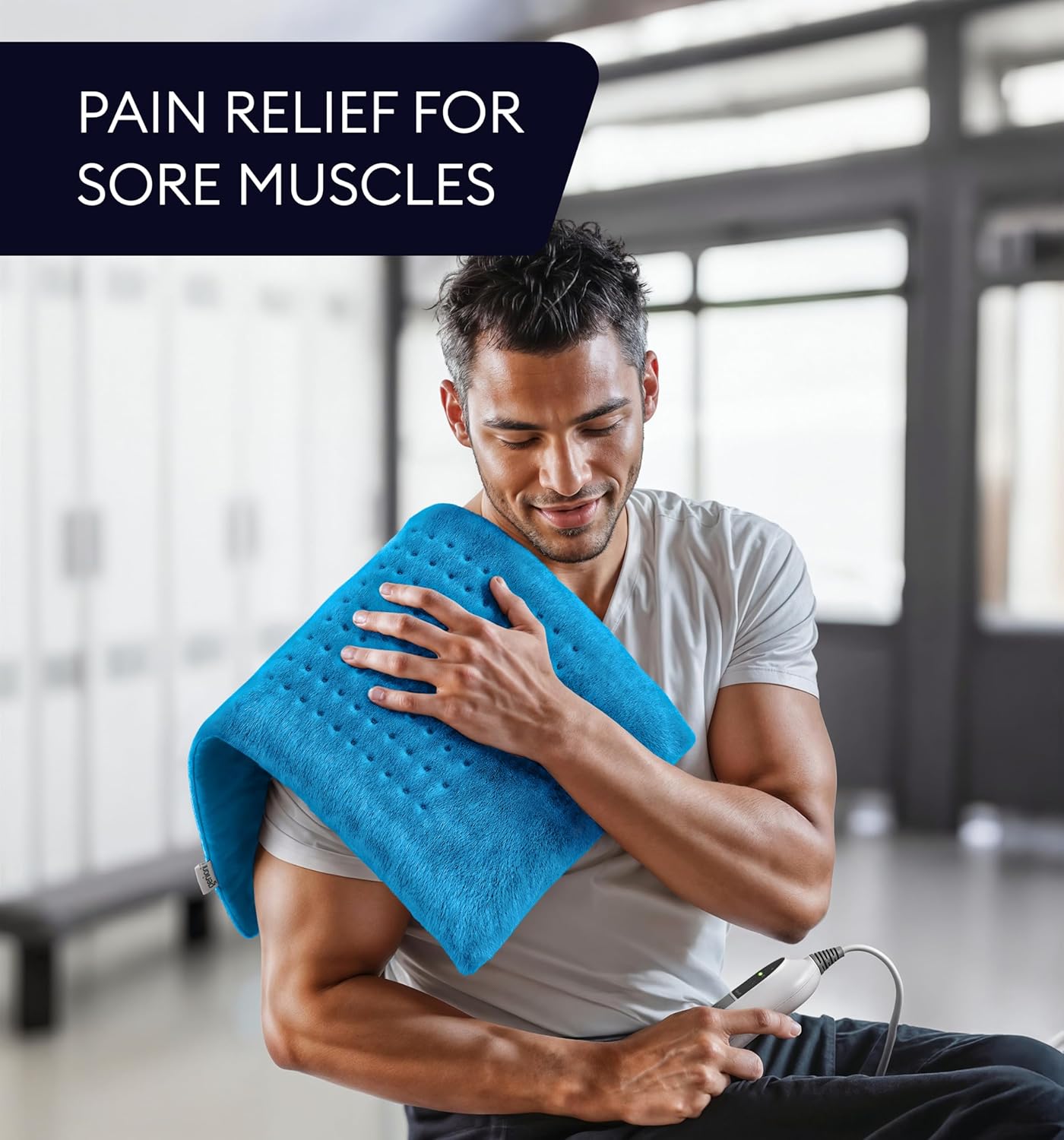 Aqua blue heating pad folded for sore muscles, held on a person’s shoulder