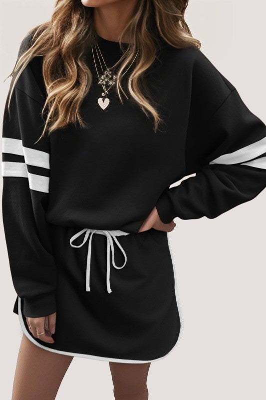 Black pullover sweatshirt and mini skirt set with white striped sleeves and lace drawstring waist