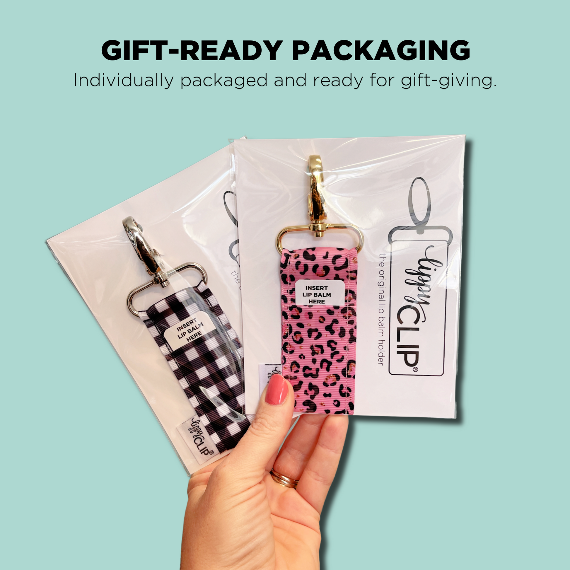 Lip balm with leopard print case held by a hand against a light blue background