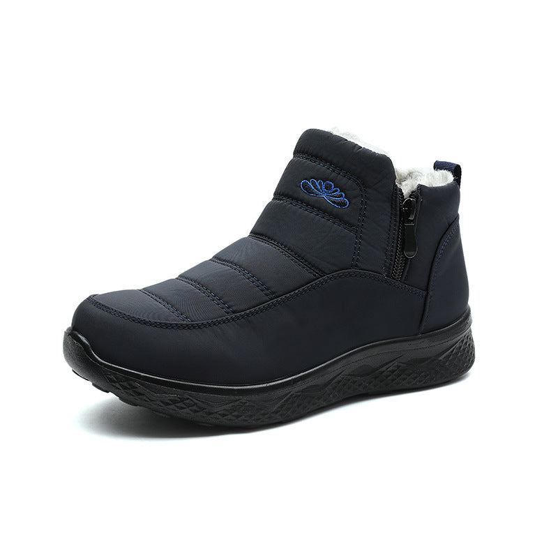 Black ankle snow boot with side zipper and quilted panels