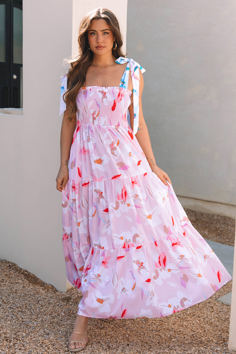 Pink floral smocked maxi dress with knotted shoulder straps, tiered skirt