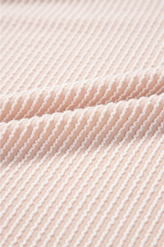 Blush pink striped corded fabric texture, close-up