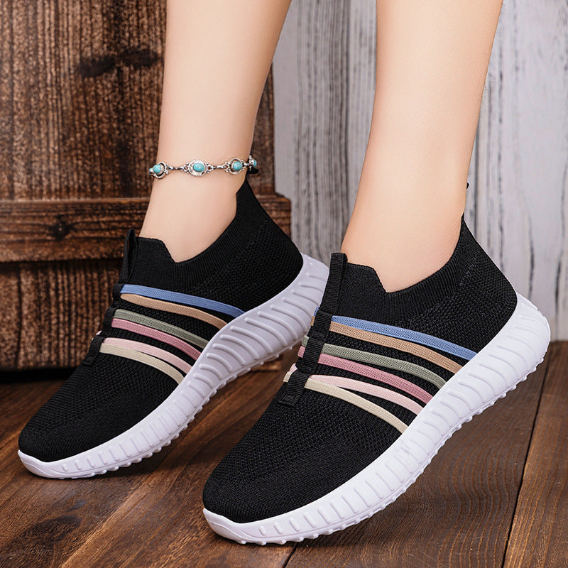 Black breathable knit slip-on shoes with multicolor striped band and white sole