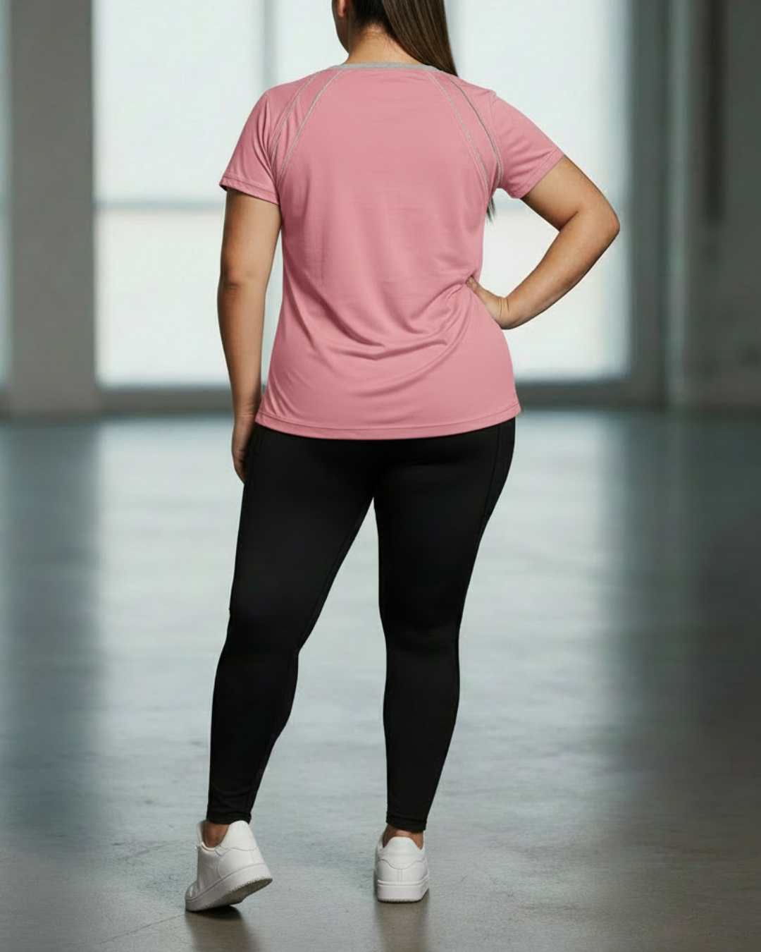 Pink sport tee back view with gray contrast piping seam lines