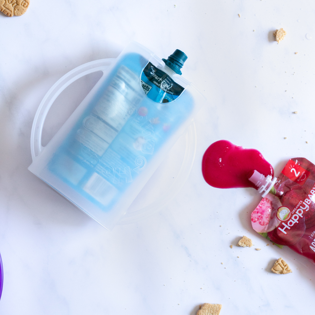 Light blue flipping holder with handles holding a transparent food pouch