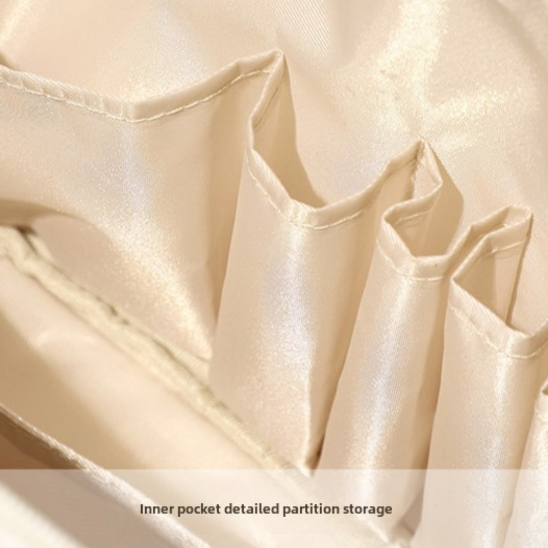 Beige waterproof makeup tote bag interior with divided inner pockets