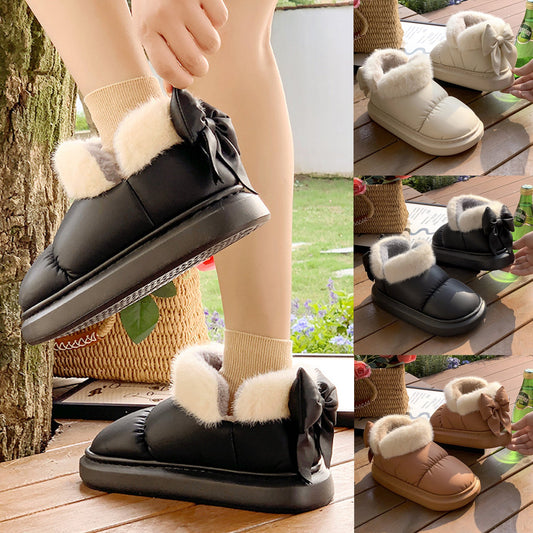 Black winter ankle boots with faux fur cuff and side bow, thick rubber sole