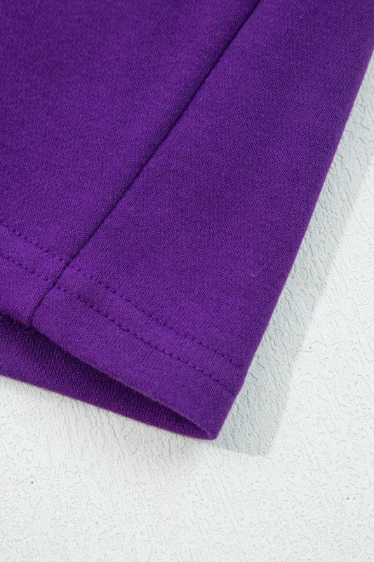Varsity stripe pullover sleeve in purple knit with ribbed cuff and stitched seam