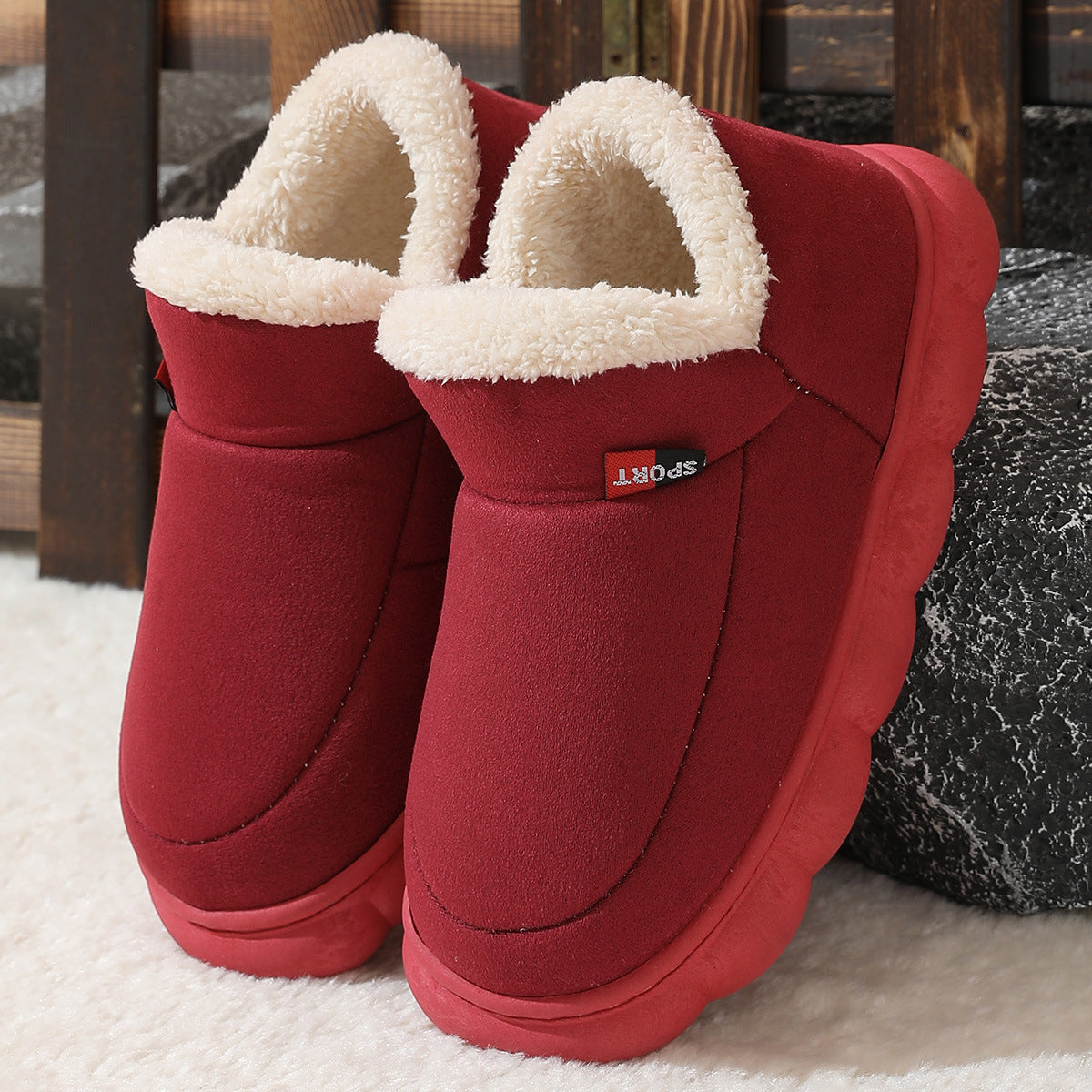 Wine red plush house shoes with fuzzy strap and thick white sole, back view