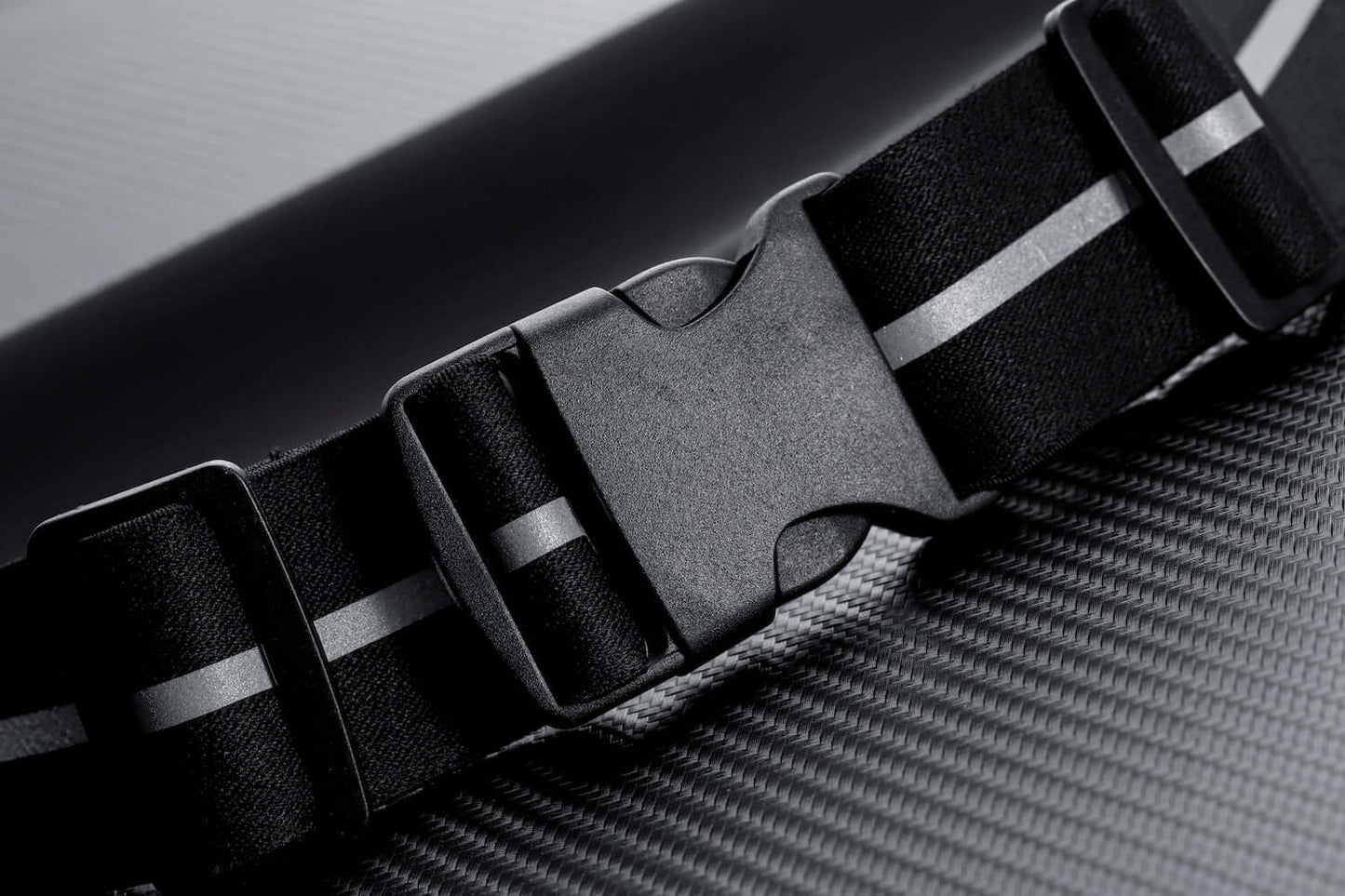 Water-resistant sport waist pack belt, black adjustable strap with plastic buckle.