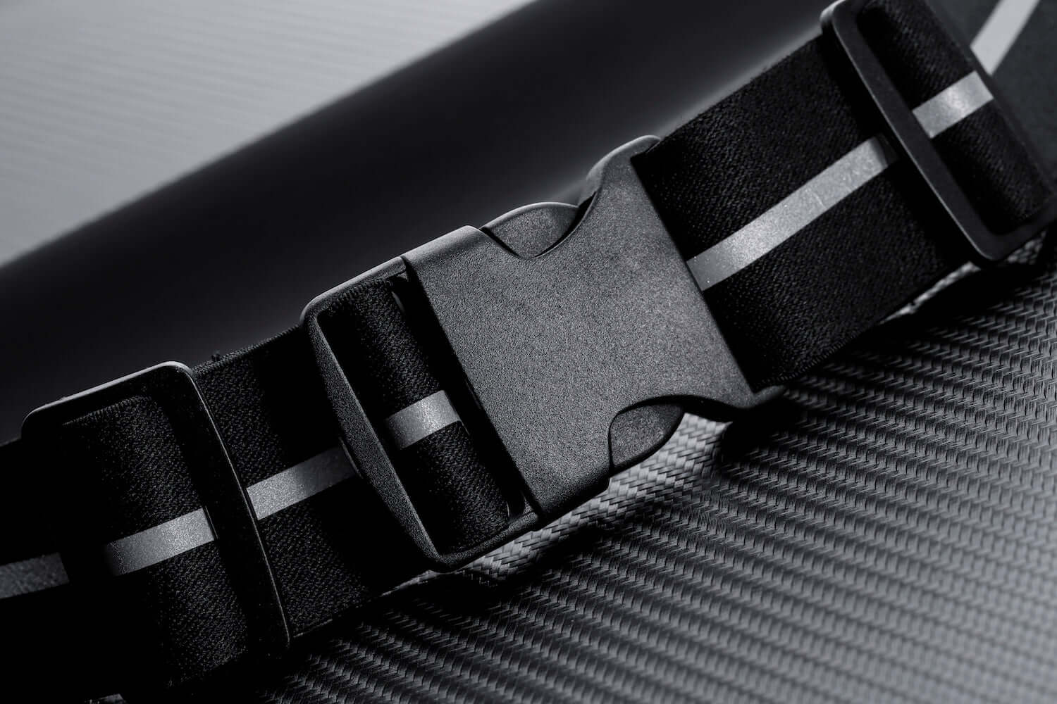 Water-resistant sport waist pack belt, black adjustable strap with plastic buckle.