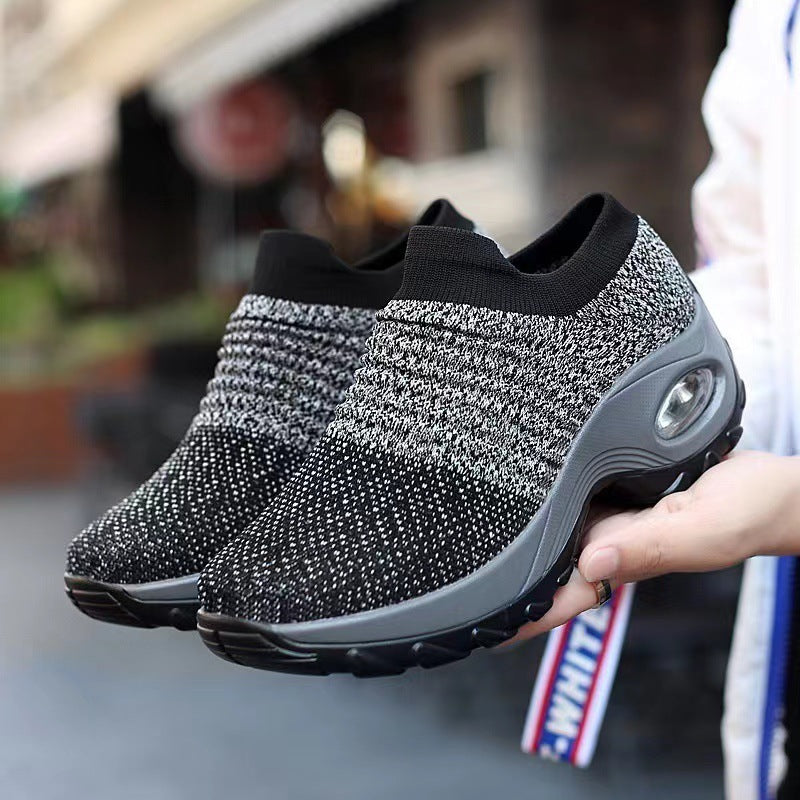 Speckled gray knit slip-on sneakers with gray sole and air-cushion window