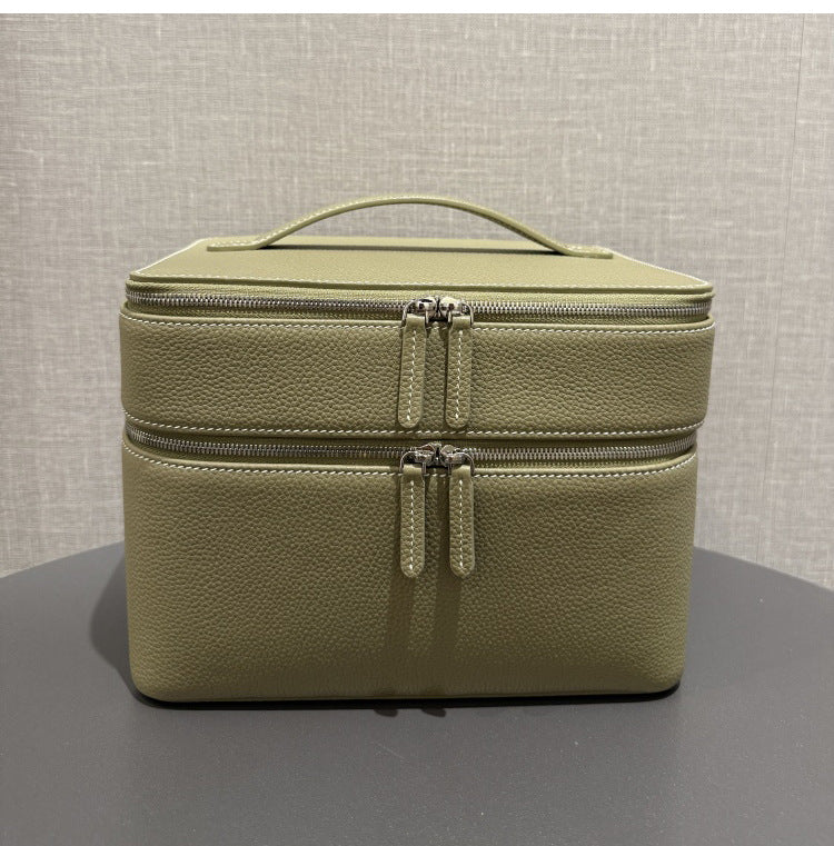 Olive-green leather-look jewelry storage tote with double zippers and top handle